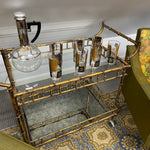 Hollywood Regency Faux Bamboo Distressed Brass Rolling Metal and Glass Bar Cart