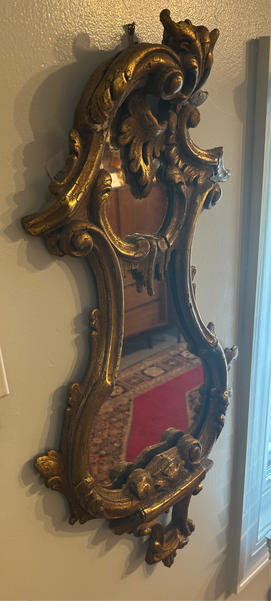 Antique gold mirror, curved and decorative