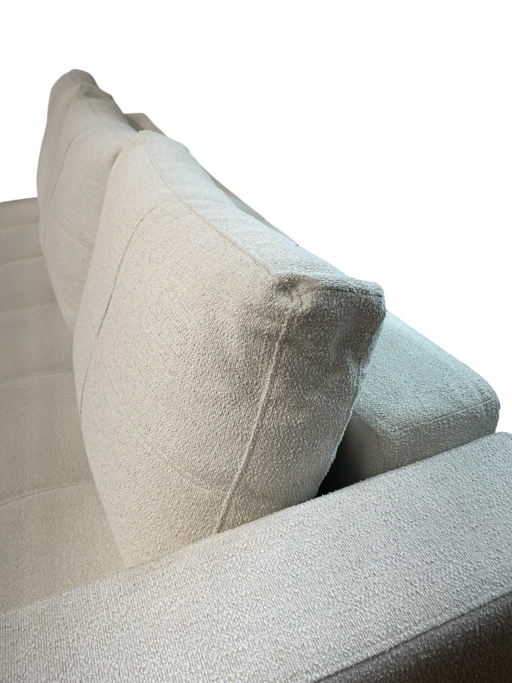 Magpie Reclamations mid-century modern sofa in textured cream fabric with tufted cushions and minimalist silhouette