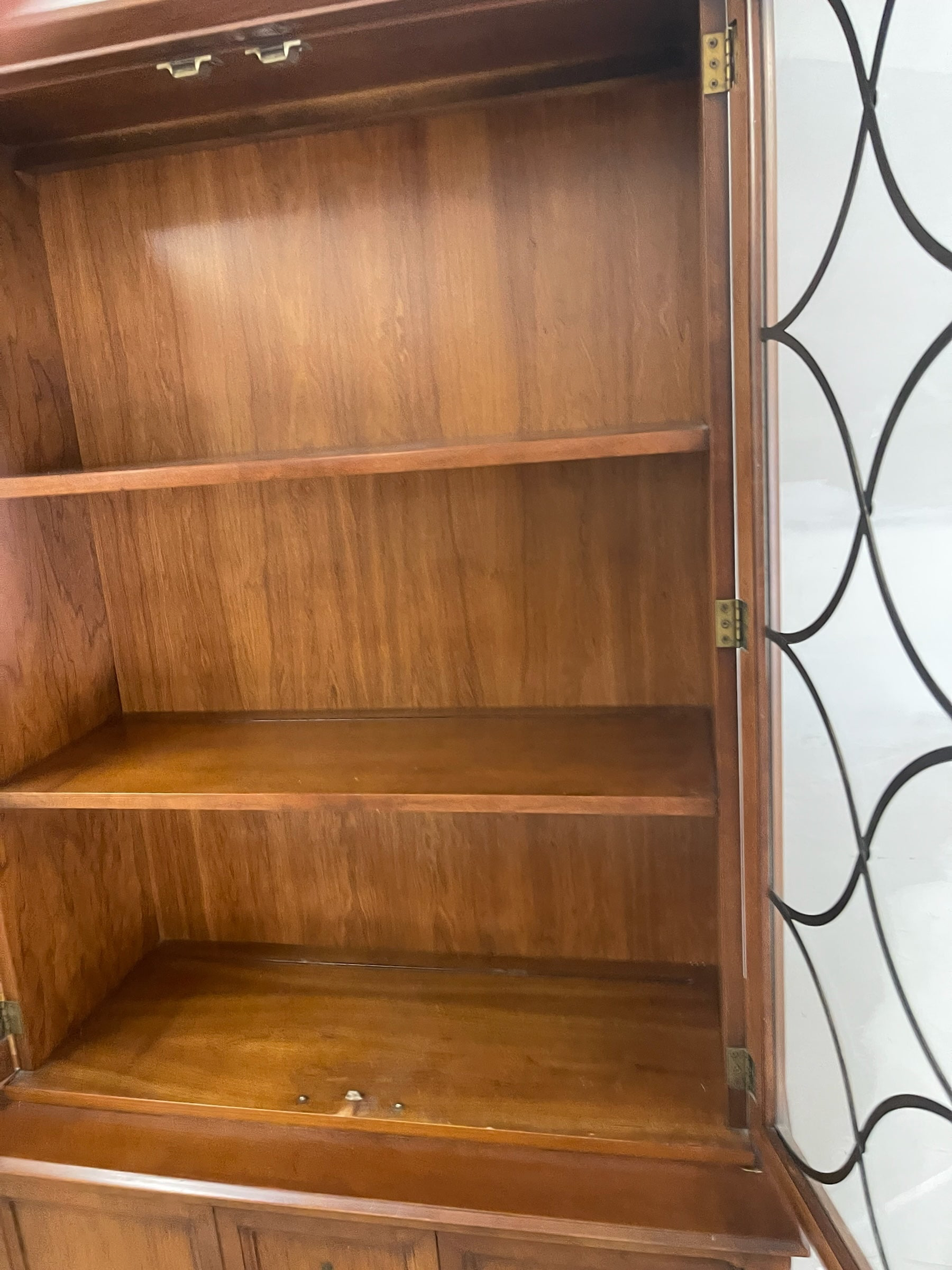 Magpie Reclamations traditional wooden china cabinet hutch featuring glass doors with intricate lattice overlay.